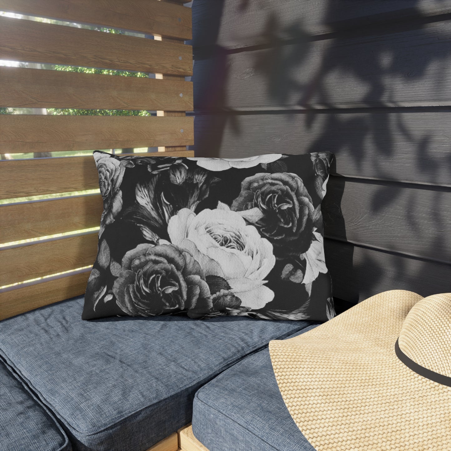 Black and white floral outdoor pillow with elegant pattern, perfect for patios and outdoor decor